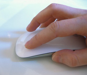 photo of a hand on a computer mouse